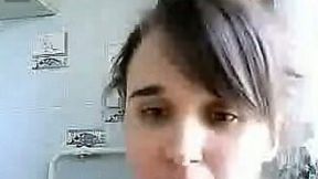 Webcam solo with a teen smoking and flashing her tits