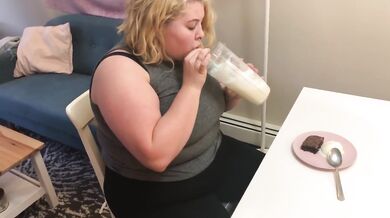 Chubby teen guzzles weight gain shake till her bloated belly bulges