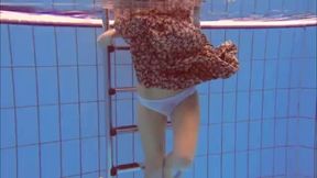 ”Ginger Katka playing underwater”