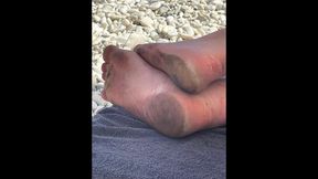 my stepmother's dirty feet on the beach and in flip flops