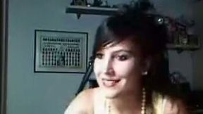 Cute lack haired coed flashes her boobs in see through bra