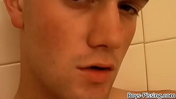 Horny young man splashing piss and cum in the shower