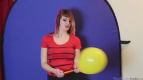 Krystall blows up balloons from her bra and pops them after