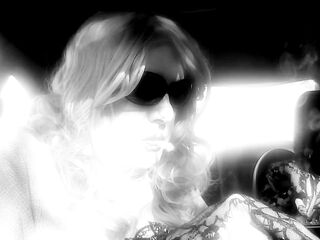 MRS. ROMAN SMOKIN' MARLBORO 100's IN HER CAR