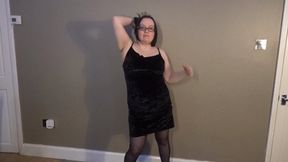 Striptease in black dress holdup stockings high heels