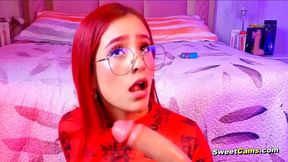 Redhead girl plays orally with her favorite toy