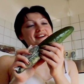 Small titted German chick sucking a cock and playing with a cucumber