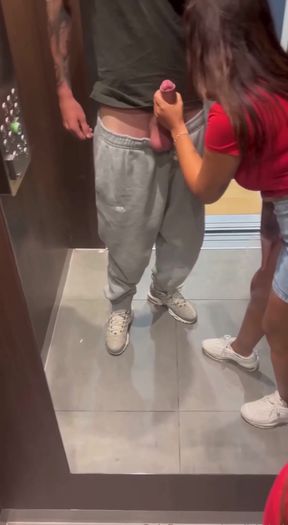 Hot brunette amateur gives a public elevator blowjob