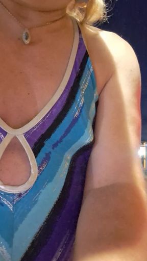 At the car wash getting wet in bathing suit and shorts!