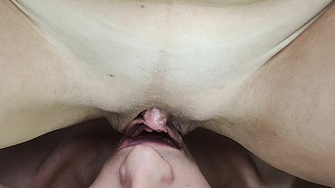 Wet pulsing vulva slides on man's tongue
