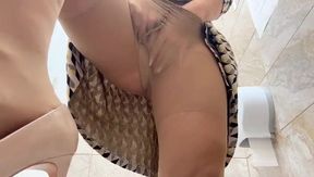 Horny Mature Woman in Pantyhose and High Heels Masturbates in a Public Toilet