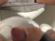 I jerk off in a public bathroom while someone pisses in the stall next to me