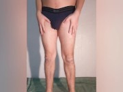 The guy shows what a chastity belt looks like in his underpants - a chastity cage in his thong