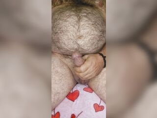 Fat shaggy bear strokes him and lets off thick load