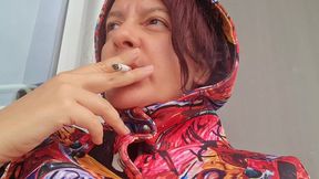 smoking cigarette on a rainy day outside the bar