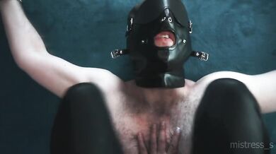 Mistress in black leggings smothers her slave while he begs in the chastity belt