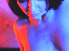 Strptease dancer is masturbating in the bed