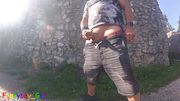 I explore the moat of a castle ruin in the mountains while playing with my half-hard, foreskin cock.