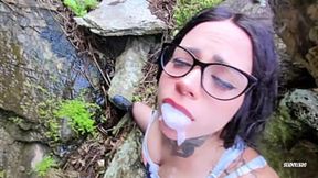 Sweet kitten licks milk from a stranger's lips