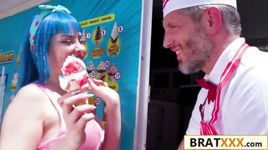 Blue-haired young woman takes on the ice cream vendor in his truck