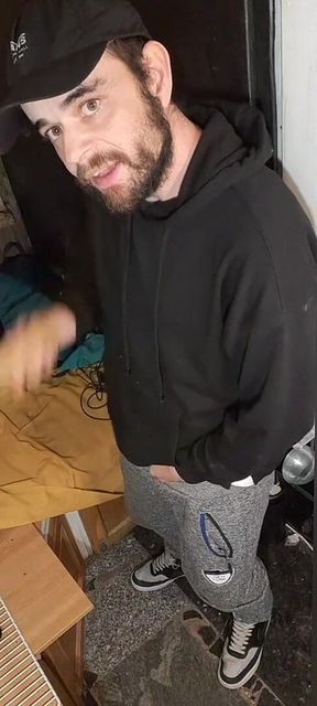 I Masturbate in Sweatpants, a Black Sweatshirt and Nike Sneakers