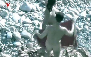 Beach voyeur. hot babe with big natural tits gives head on a public beach
