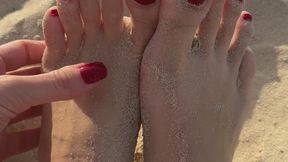 Feet in sand beach