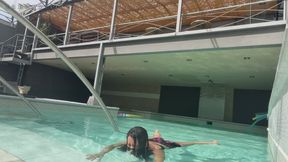 Practicing underwater breath holding for the first time at a pool