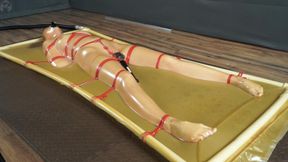 Bondage to the latex bed frame with red ropes