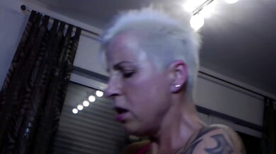German femdom mistress dominates her submissives in intense BDSM session