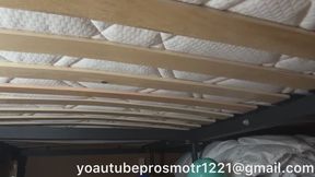 Nastya jumps on a large slatted bed, pushing through them. Her jumps are very heavy, and the slats crunch and feel hard. View from below