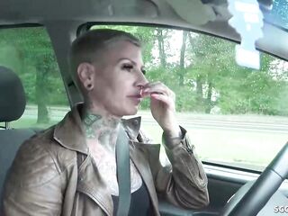 Tattooed German mature with short, blonde hair, Cat Cox is getting a dick up her ass