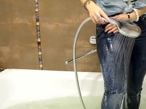 Wetlooker - Nastya takes a bath in her jeans