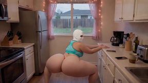 Stepmother doing yoga in the kitchen