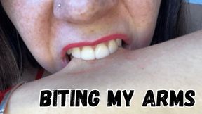 Biting my arms in pink lipstick