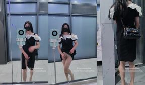 Chinese ladyboy creams her tight skirt in the public toilet