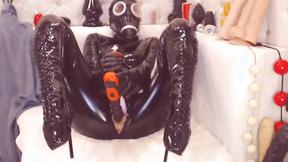 ”Submissive in Latex Drills her Muff”