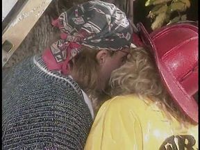 Blonde firefighters with big tits get fucked by an old hippy in field