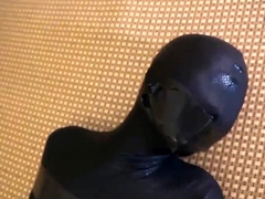 zentai encased and viborated taped bondage girl