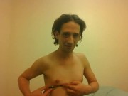 Topless Transgirl Trying to Hold a Pen w/Her Tiny Boobs