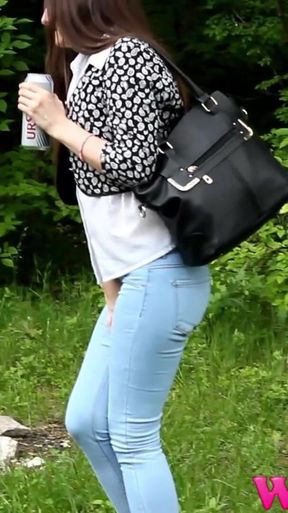 Desperate Brunette Feels Her Bladder so Full She Is in Danger of Pissing in Her Jeans in the Woods