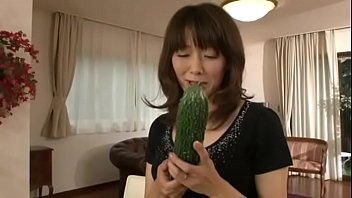 Japanese m. masturbating with a big cucumber