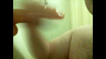 Fat faggot deepthroats dildo in shower
