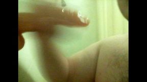 Fat faggot deepthroats dildo in shower