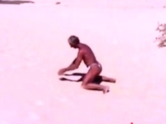 Tanned guy on beach in tiny string thong (temporarily!)