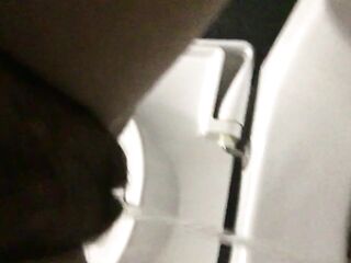 Piddle from a bushy twat in a public crapper