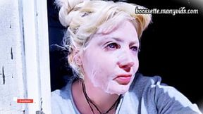 Blonde bimbo applies gooey mask to her pasty skin, winking for the cameras.