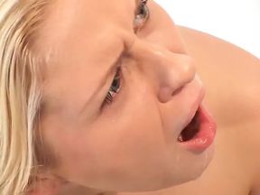 Blonde with small tits sucks cock through a hole in the toilet then gets it in her ass