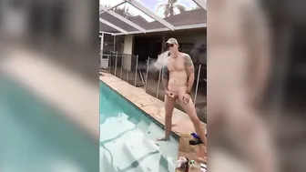 Muscular Hunk Jerks Off by the Pool with a Cigarette