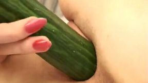 Lewd college girl smashes her cunt with a long cucumber